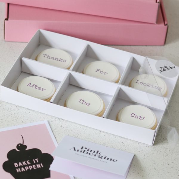 A box of shortbread cookies personalised with a gift message and card. Pink delivery box