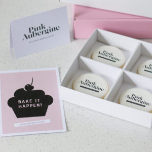 Shortbread biscuits in a gift box with a personalised printed logo topper. Gift card and message, with a pink and white postal box