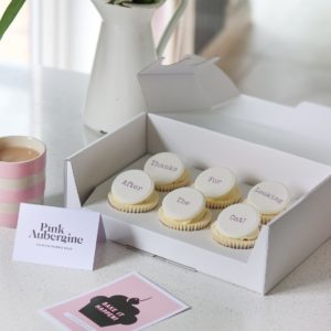 Gift Box of hand baked cupcakes in postal packaging with your personalised message printed on personalised toppers